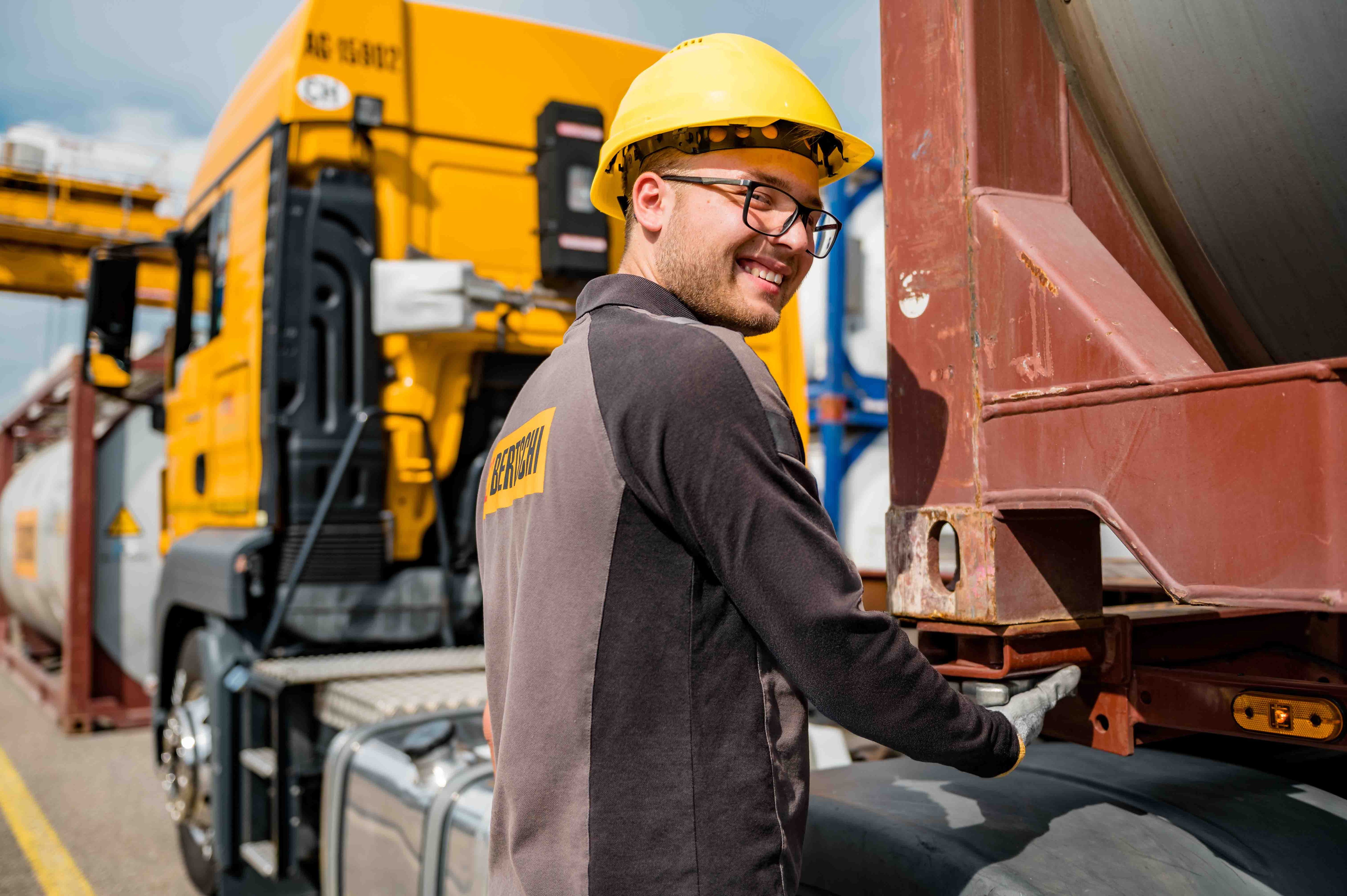 Terminal Worker fixing container onto truck