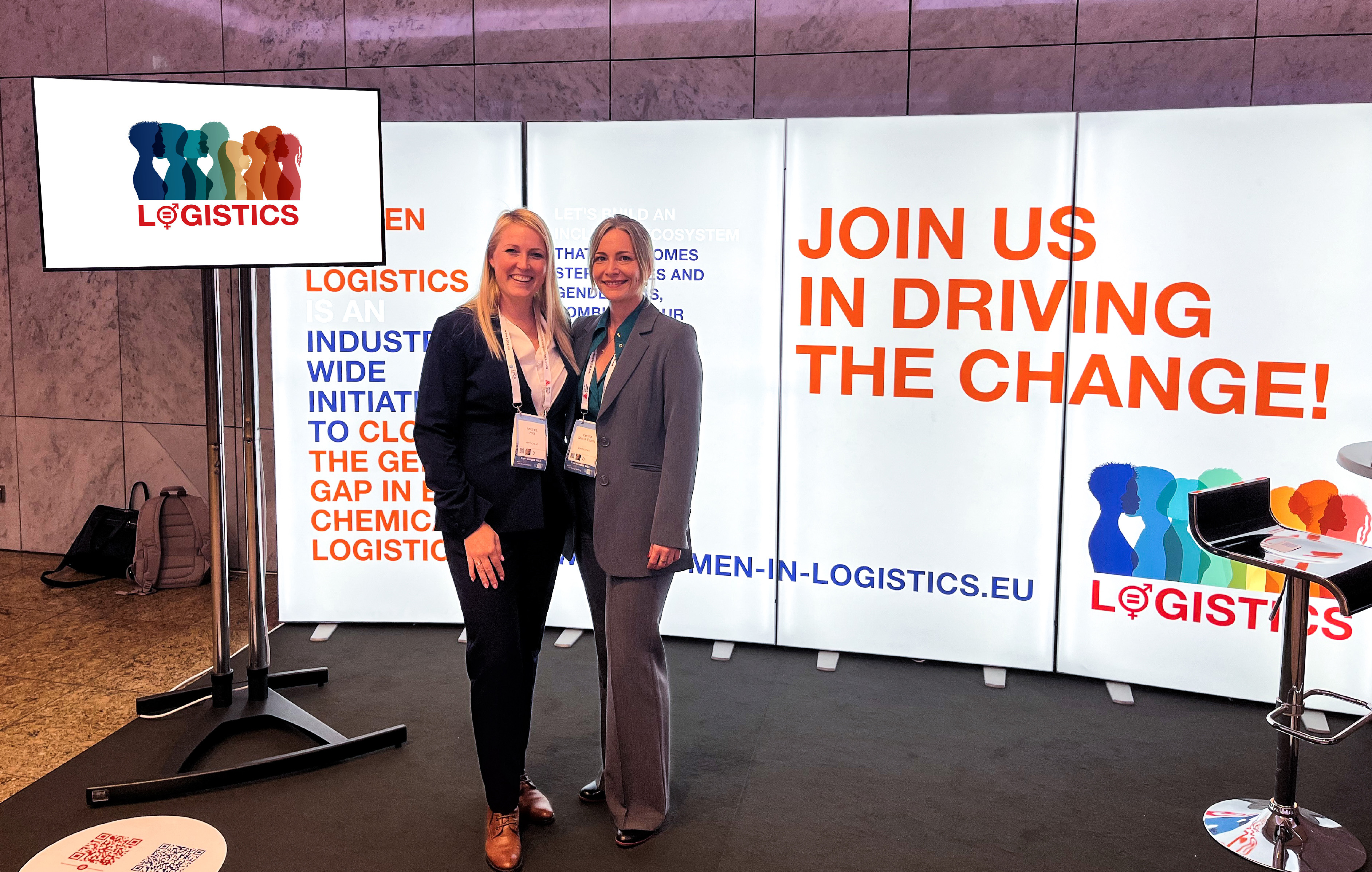 Women in Logistics stand at the EPCA seminar in October 2024 with Bertschi employees posing for a photograph