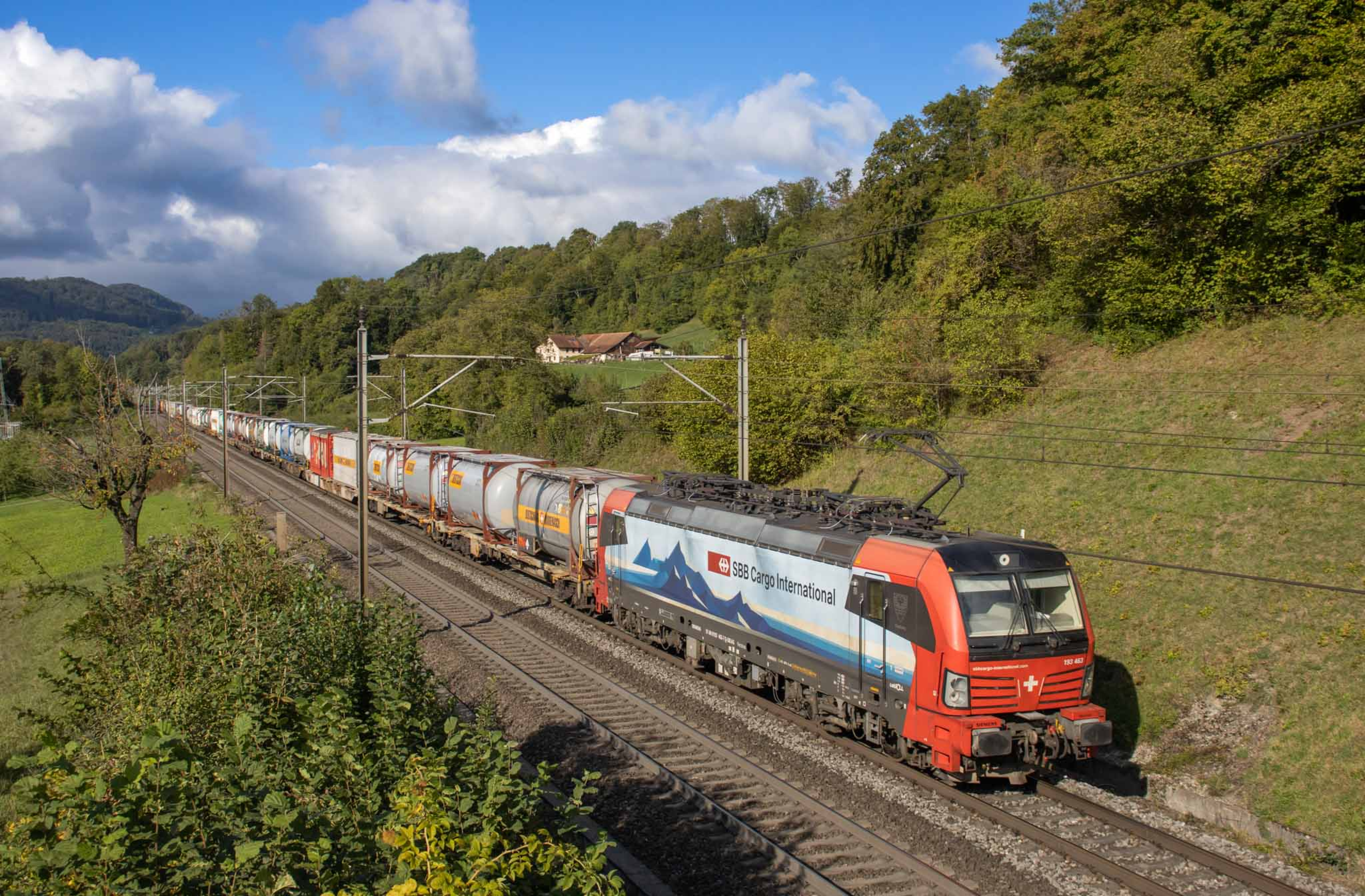 An intermodal freight train carrying Bertschi tank containers