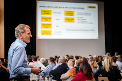 man presenting to his company employees