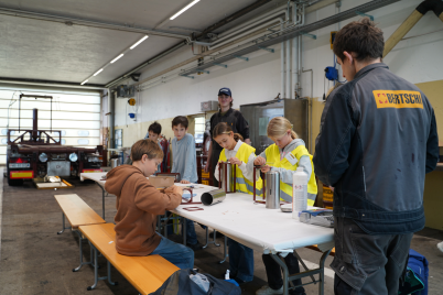children building a mini container in a workshop