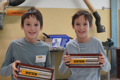 two boys standing with their finished mini container
