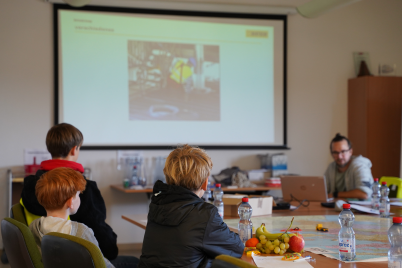children watching presentation about the company