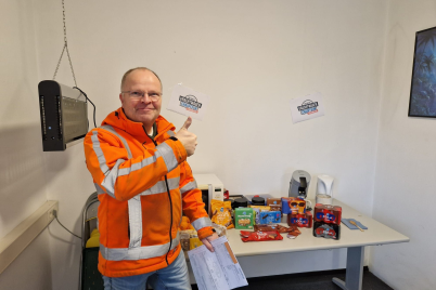 man standing infront of a table with food