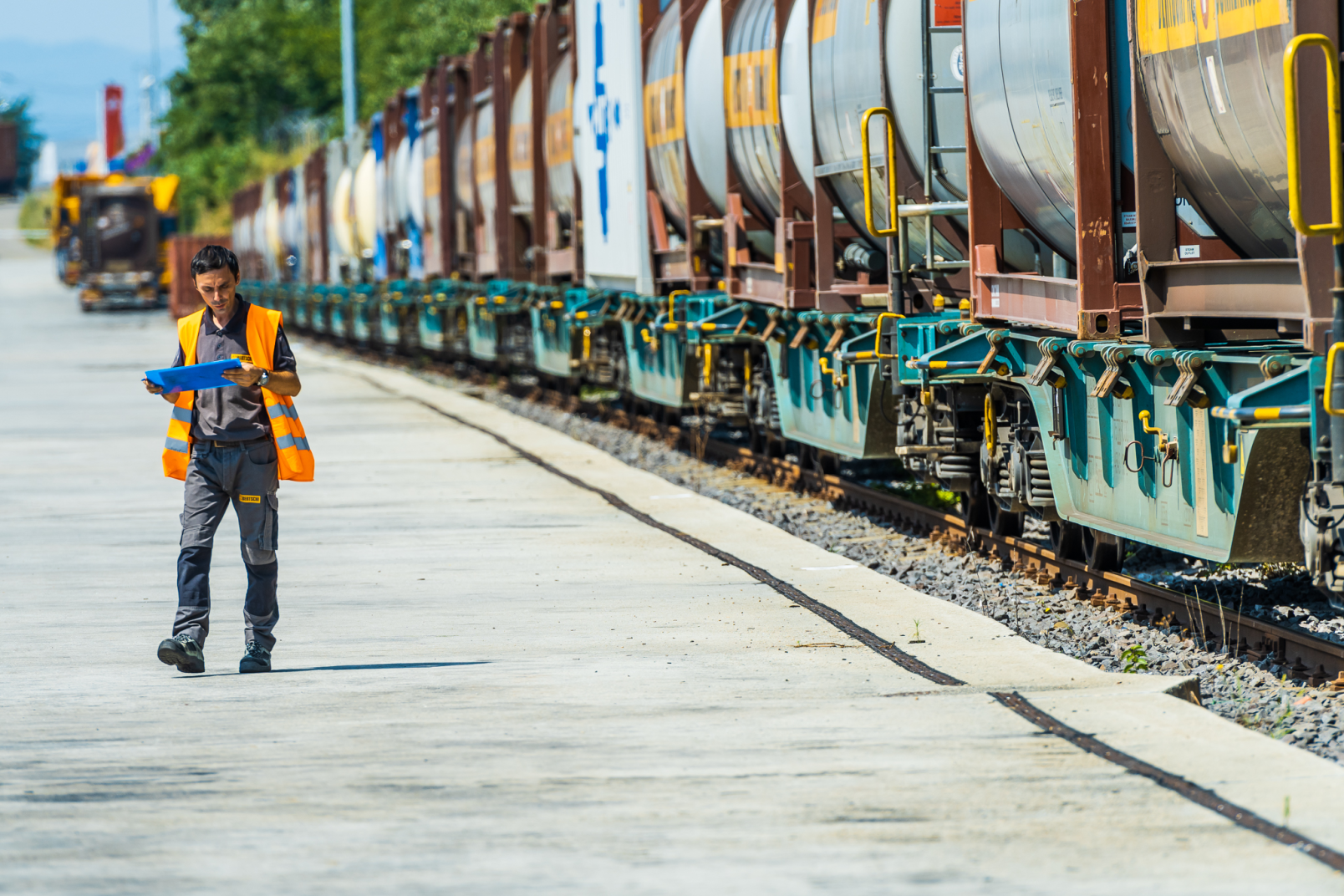 Man standing next to a cargo train