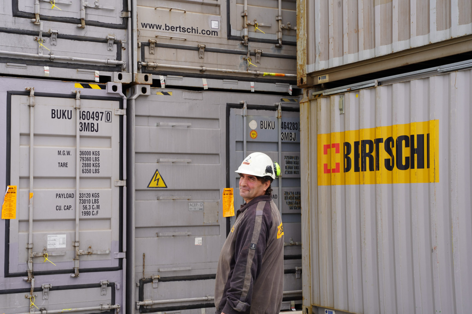 Person infront of containers