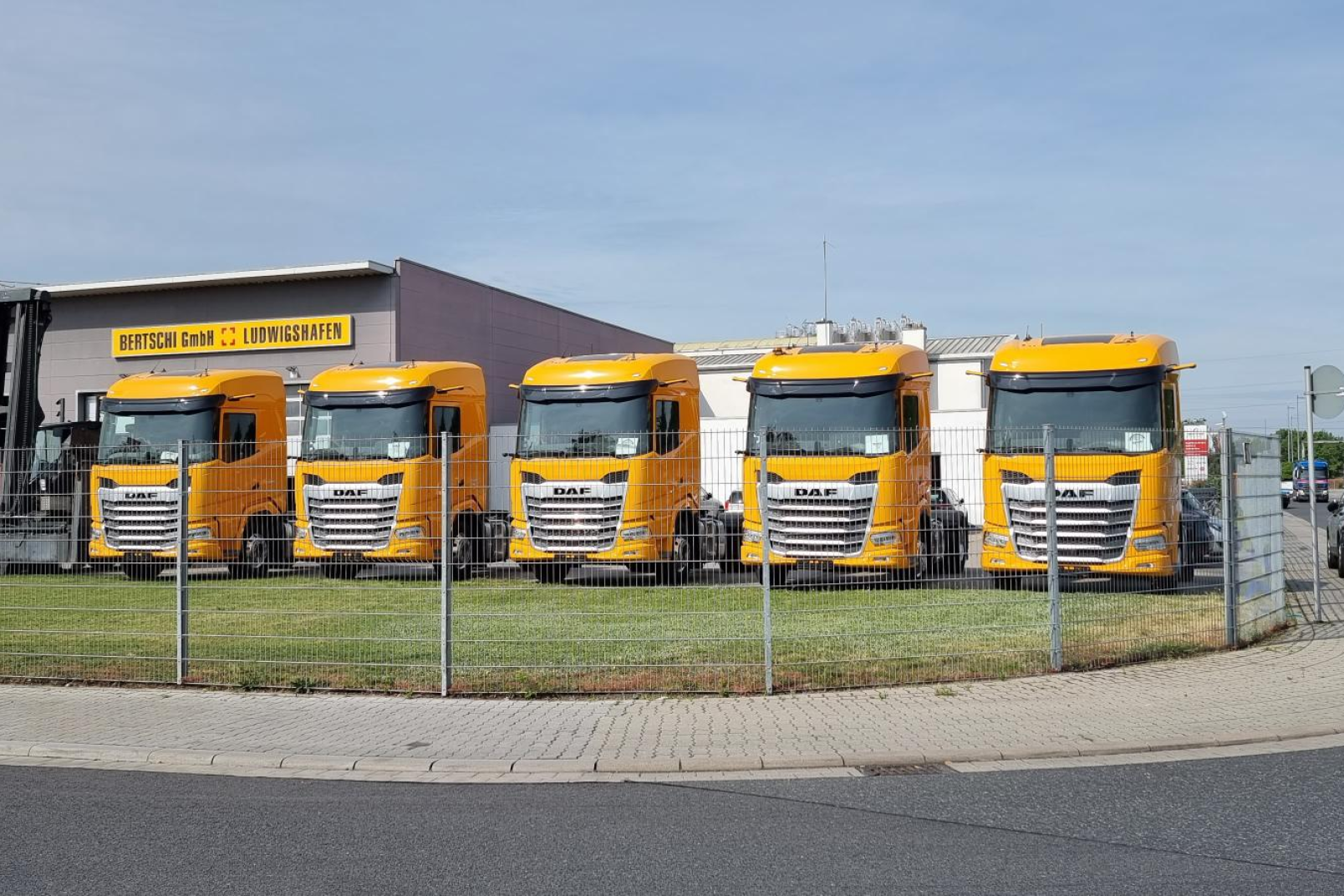 All Trucks in a row and the Terminal in the Background