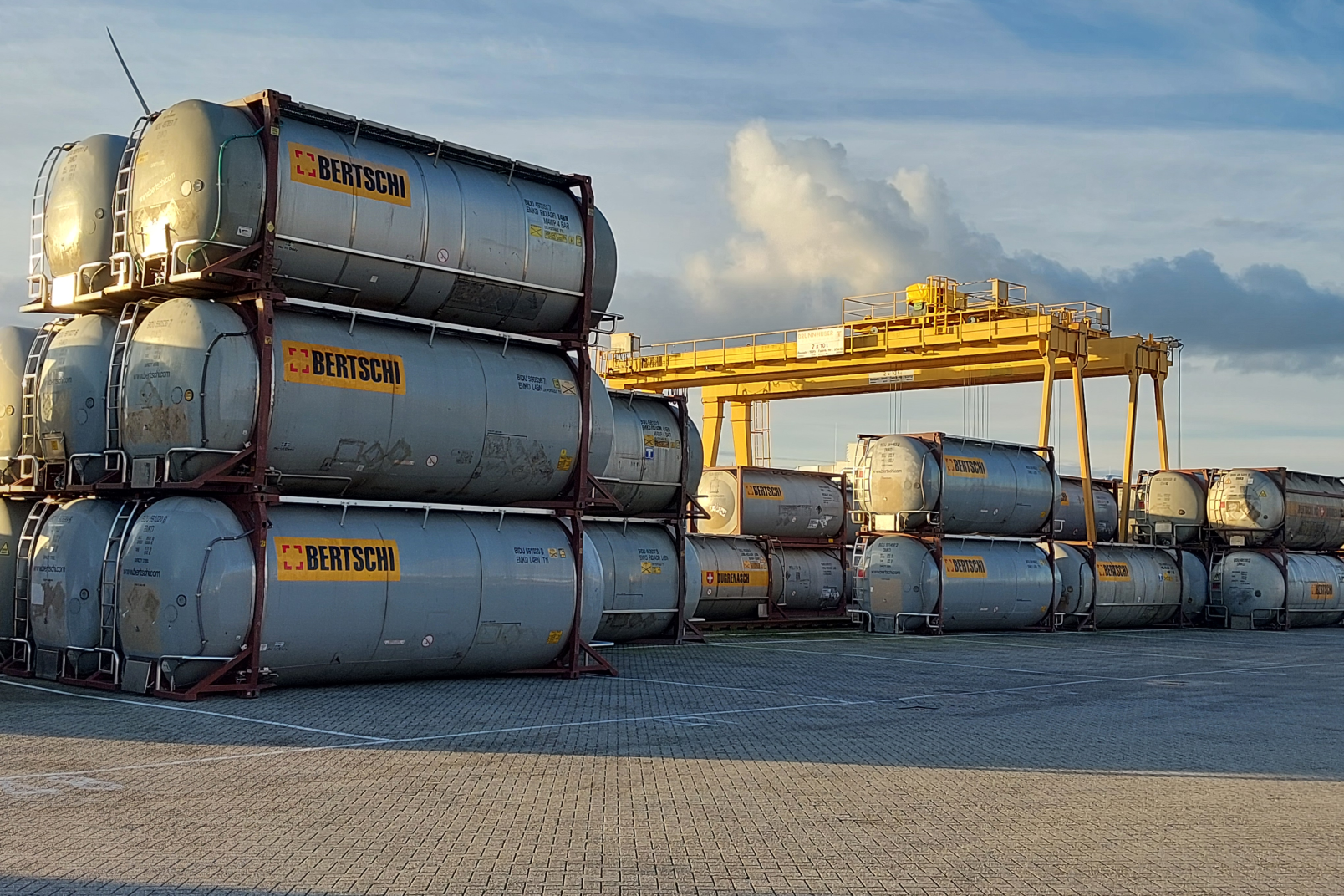Some containers are stacked on top of each other and some just stand there