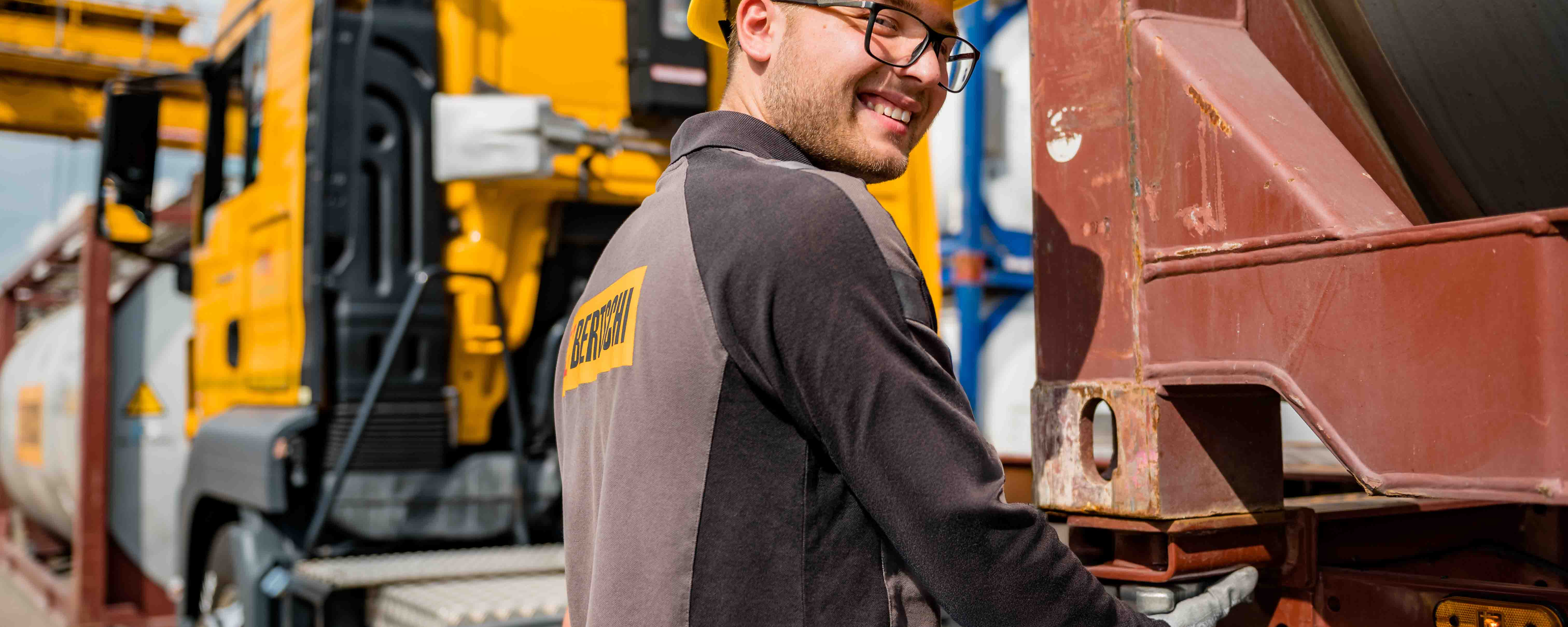 Terminal Worker fixing container onto truck